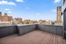 Wooden deck with a view of city