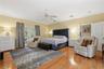 THE MASTER BEDROOM IS VERY SPACIOUS AND ENTENDS TO THE SCREENED PORCH THRU FRENCH DOORS