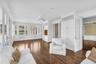 Sunroom with French doors leading to the beautiful backyard
