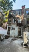 Back of property featuring brick siding