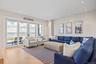 Media room/den with water views, and wood flooring