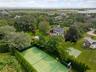 All weather tennis court newly refurbished.