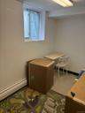 Home office with a baseboard heating unit and baseboards