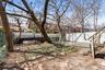 View of yard with fence and a residential view