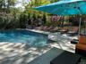 in ground Swimming pool with a patio