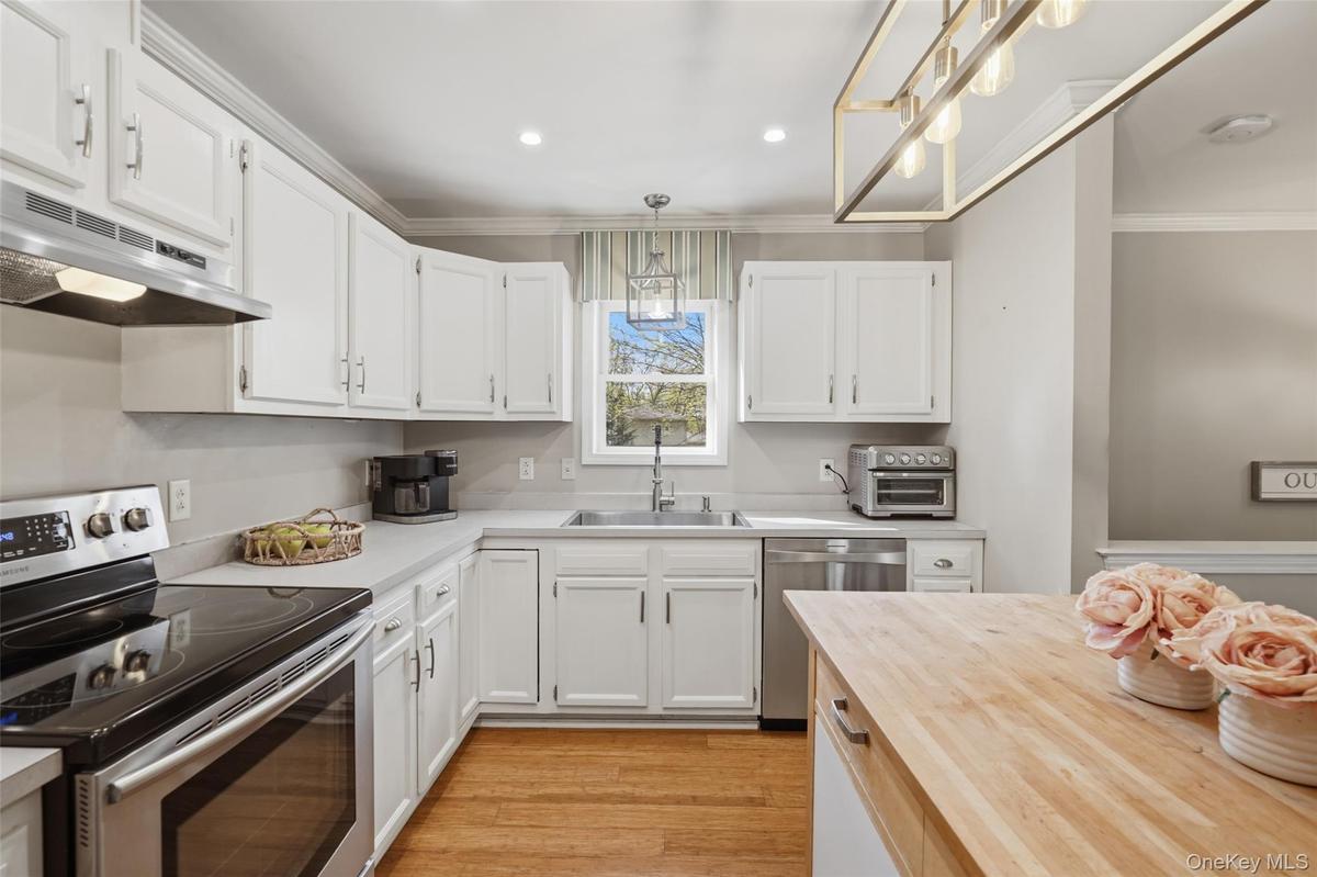 White cabinetry with brushed nickel hardware