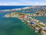 Drone view indicating 4 Bellevue Drive with the Intracoastal and Devil's Elbow on the left and the Gulf waters and beaches to the west above.