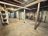 Unfinished basement featuring heating fuel