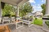 Welcoming front porch offering the perfect space to relax and enjoy the neighborhood setting.