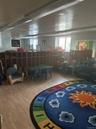 Rec room with healthy amount of natural light and wood finished floors