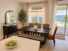 14048 Larkspur Lake Dr - Virtually staged. Dining area conveniently located off the kitchen with views toward the backyard. Virtually staged.