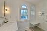 Bathroom with a shower stall and vanity