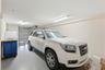 Spacious garage, currently one car as the current owners put up a partition wall for storage (next pic) which can easily be taken down to convert back