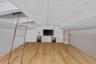 Below grade area with light wood-style flooring