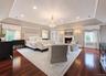 Masterfully Designed Primary En Suite with his/hers walk-in closets, fireplace and office