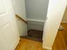 Stairs off of entryway leading to basement