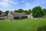 Expansive and beautifully level, this rear property area provides a rare sense of openness and versatility.