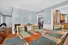 Dining space featuring plenty of natural light, wainscoting, and wood-type flooring