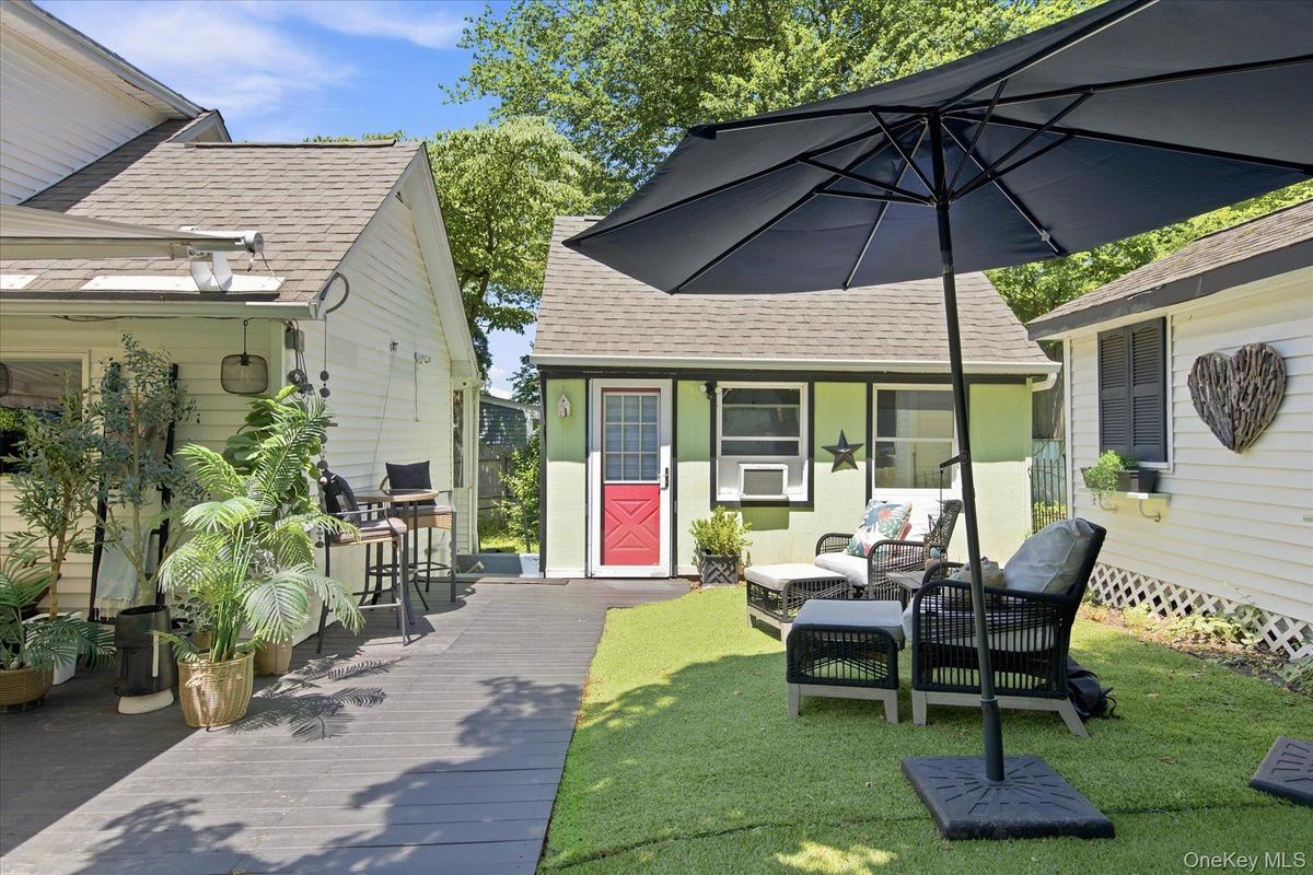 Outbuildings include a private workshop and garden shed