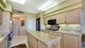LAUNDRY ROOM BEHIND DOOR AT ENTRY OF KITCHEN