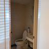 Half bathroom with tile patterned floors and toilet
