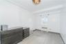 Unfurnished bedroom featuring light wood-style flooring and radiator
