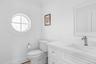 Bathroom featuring vanity and crown molding