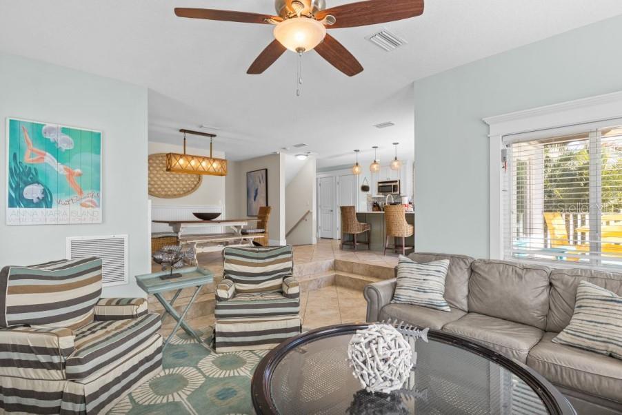 Open concept primary living area, dining and kitchen area