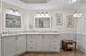 The expansive dual vanity creates a sense of balance, comfort, and everyday ease.