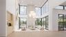 The great room blends refined interiors with the surrounding landscape; anchored by a sleek linear fireplace and complemented by a built-in bar with w