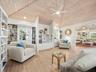 The cozy library area invites you to curl up with a good book when you are not out on your boat or at the beach.