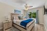 Bedroom 1 with sliding glass door to pool