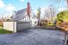 Big driveway and view of garage.