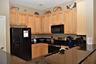 Range, microway, refrigerator and all the utensils for a gormet meal.