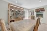 Dining room featuring light tile patterned flooring and recessed lighting