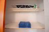 Closet, ironing board, iron, additional towels