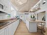Light and bright make this kitchen a pleasure for meal preparation time.