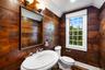 Powder room in den. French doors close for privacy.