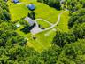 Aerial view of the side of the house and yard.