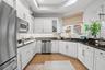 Large, beautiful Kitchen with substantial counter space and cabinetry.