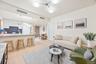 Living area with light wood-style flooring, a chandelier, and recessed lighting