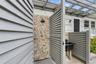 View of exterior entry with stone siding