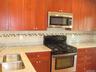 This is the kitchen in all of the other units, featuring Granite Counters and Stainless Steel Appliances!