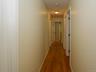 Upstairs hallway leading to full bathroom and four bedrooms