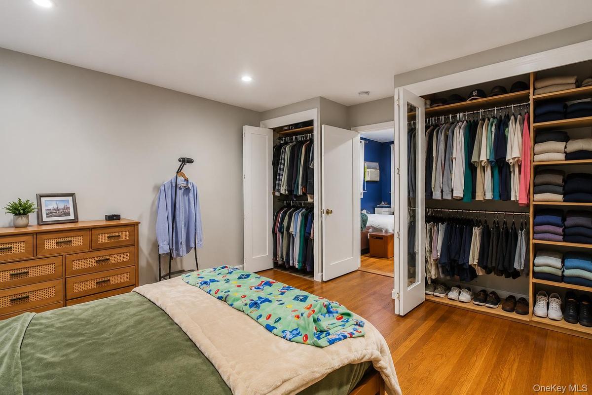 primary Bedroom unit with fitted closets good closet space