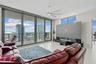“smart” family room features a comfortable leather sofa with three motorized loungers, a 120” state-of-the-art projection TV that rises from the floor