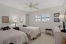 Bedroom 2 at front of unit also features a walk-in closet and Plantation shutters