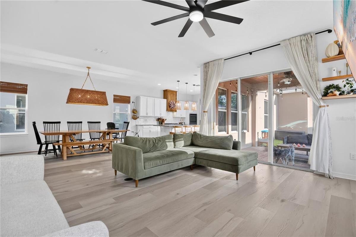 Living room, Kitchen and outdoor patio view