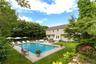 Swimming pool with a yard, a patio area, entry steps, and an outdoor living space