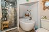 MASTER Bathroom featuring independent shower and bath, hardwood / wood-style flooring, and toilet